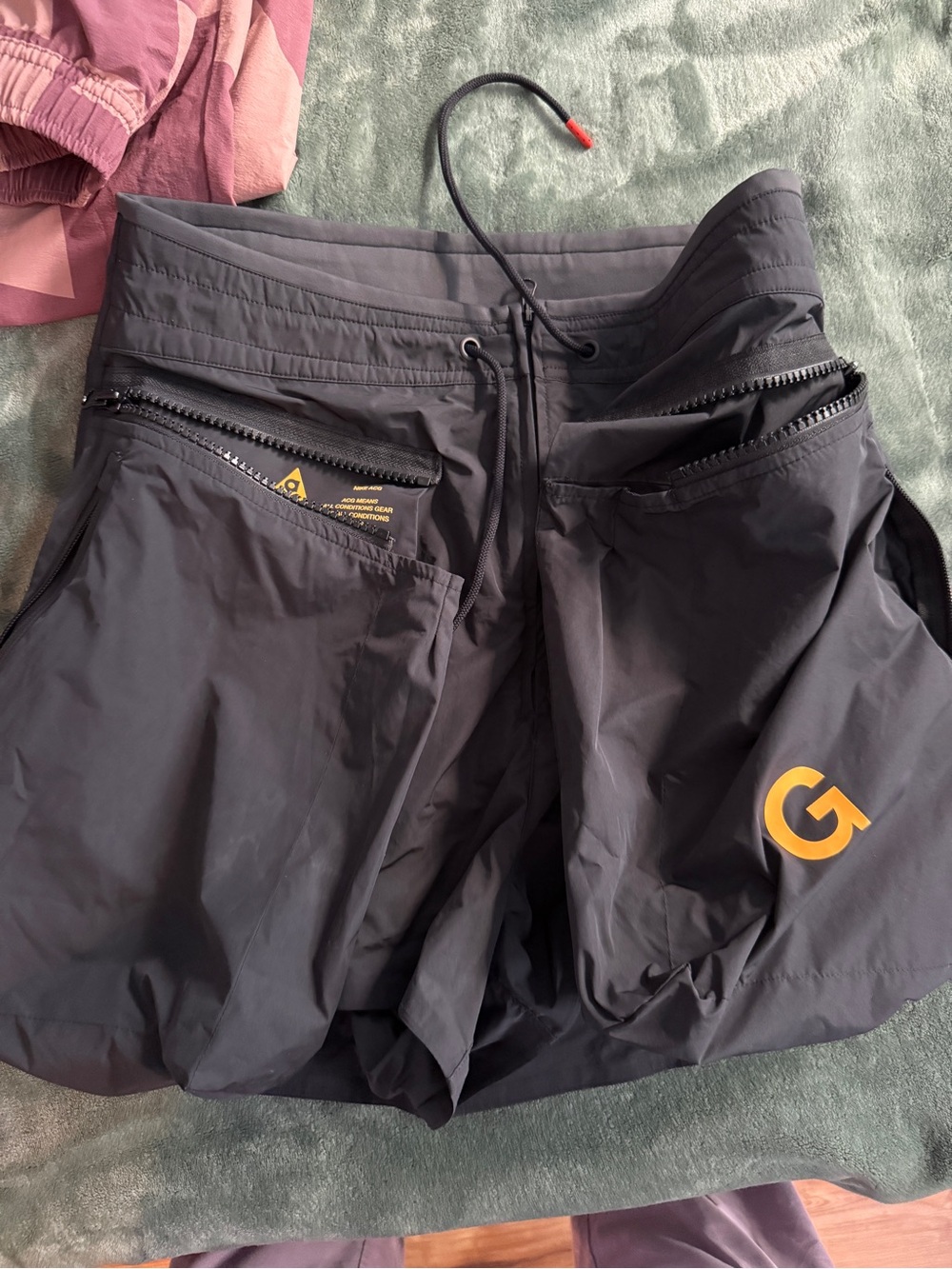 Nike ACG Black Shorts with Yellow Logo